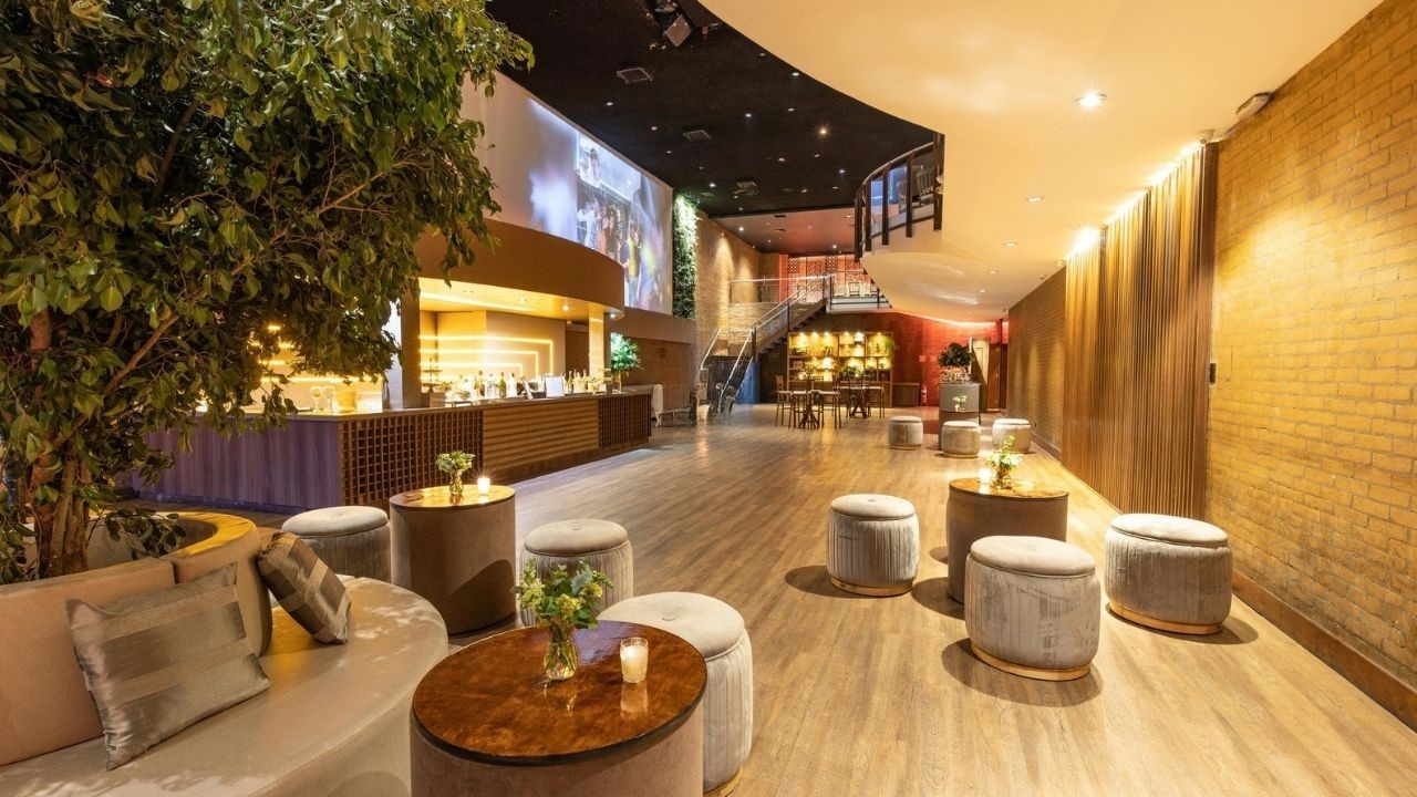 Luxury lounge and entertainment area with bar counter and plush seating at Forbes Fab Luxe clubhouse